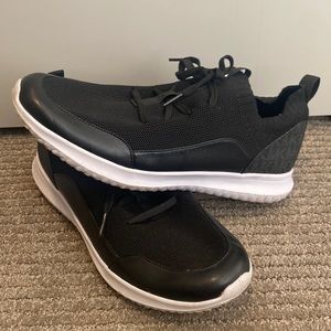 Michael Kors black tennis shoe